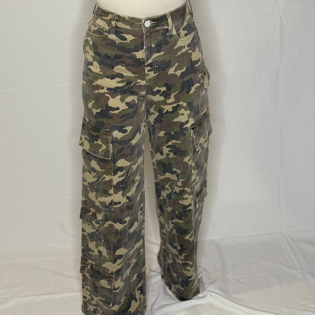 Camouflage pants on a mannequin against a white background